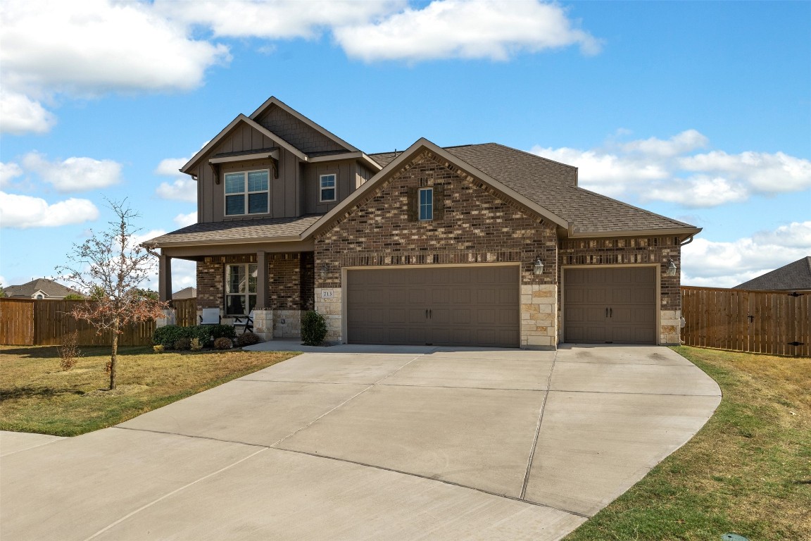 a front view of a house with yard