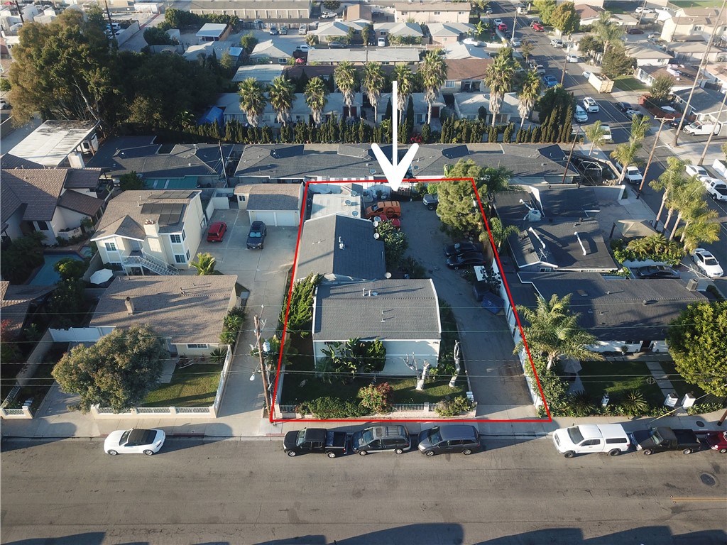 an aerial view of a city with streets and houses