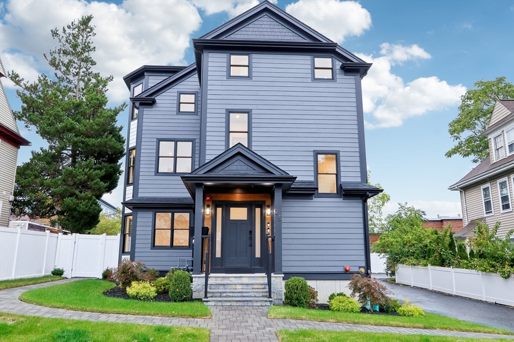 a front view of a house with a yard