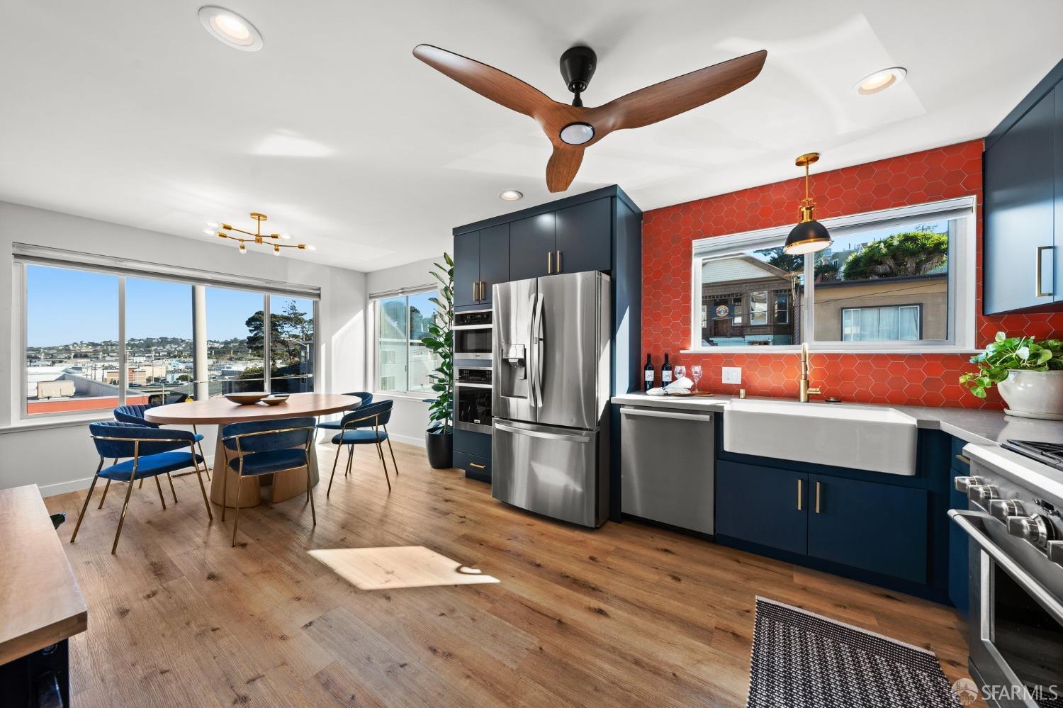 a living room with stainless steel appliances kitchen island granite countertop furniture and a view of kitchen