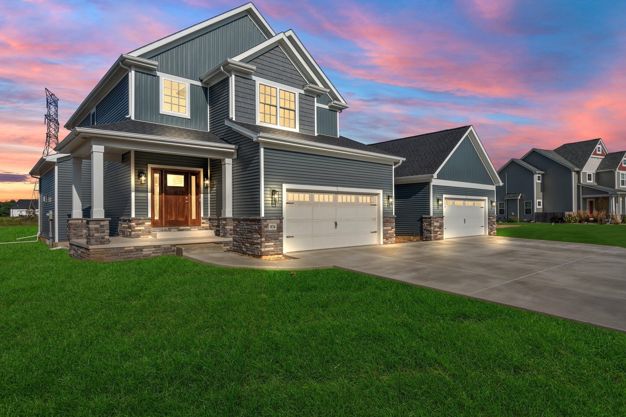 a front view of a house with a yard