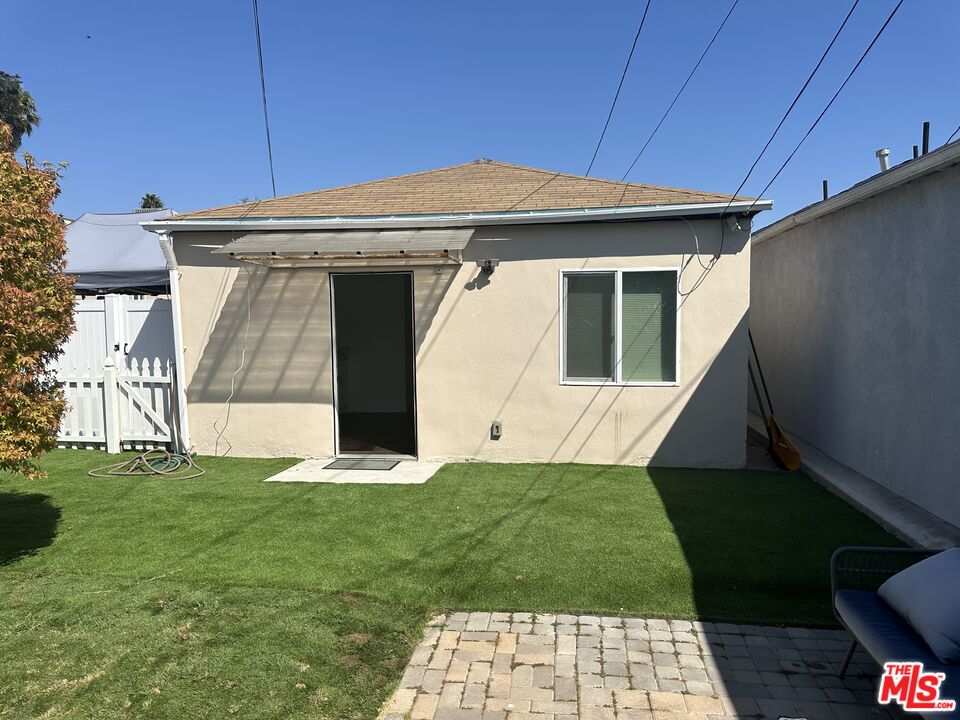 a view of a back yard of the house