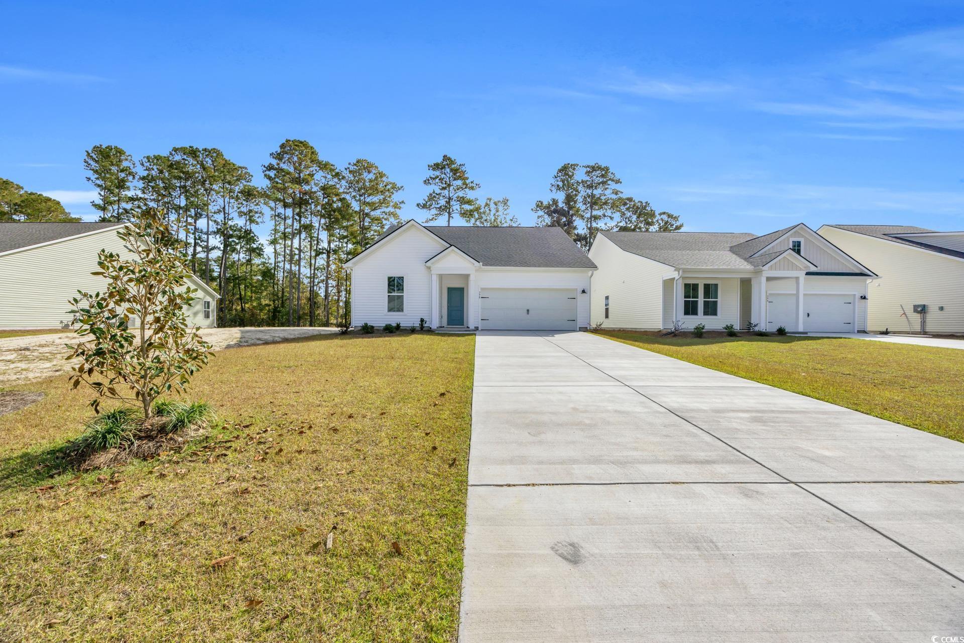 View of front of house featuring a front lawn and