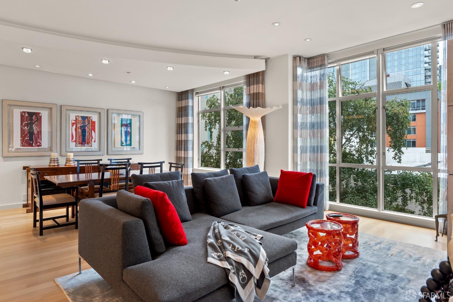 a living room with furniture and large window