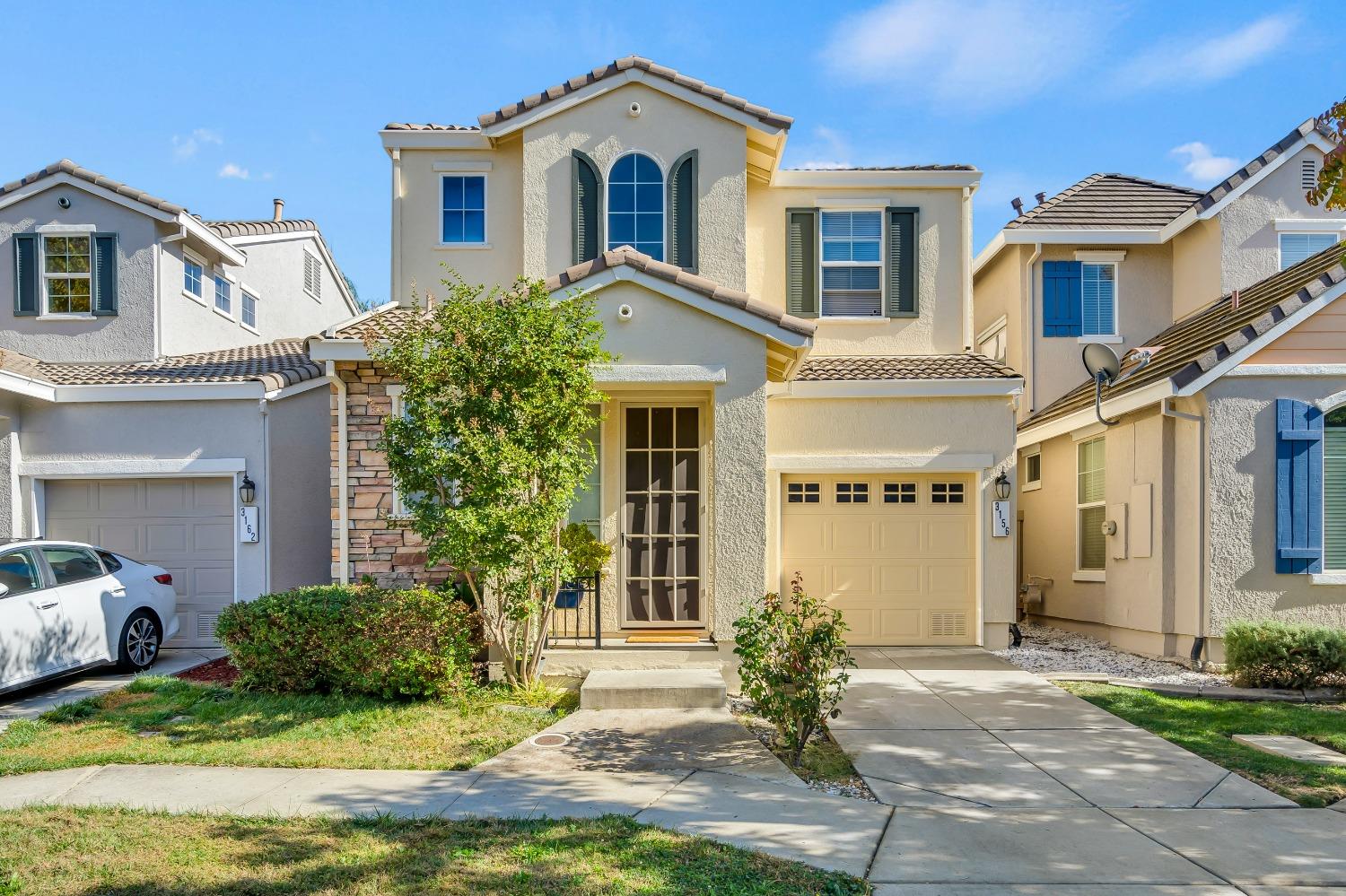 a front view of a house with a yard