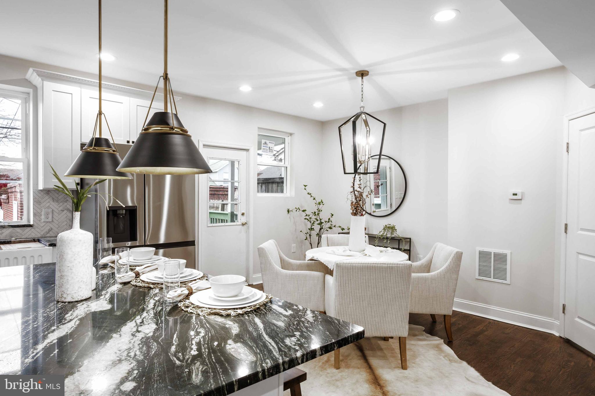 a very nice looking dining room with furniture