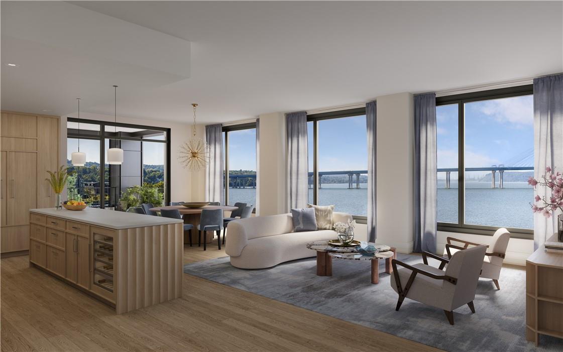 a living room with furniture and large windows