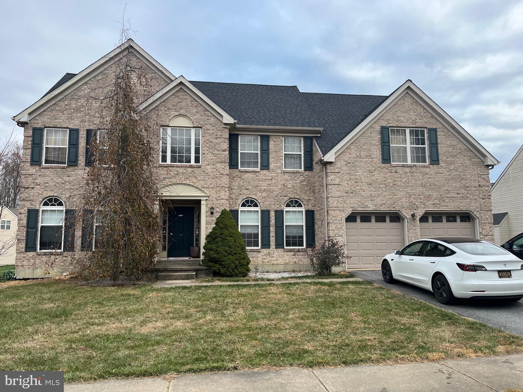 a view of house with yard and entertaining space