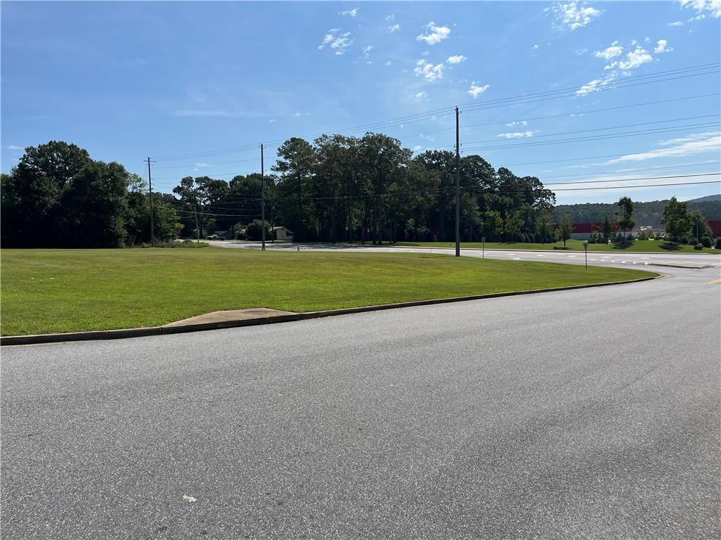 a view of a golf course with a road