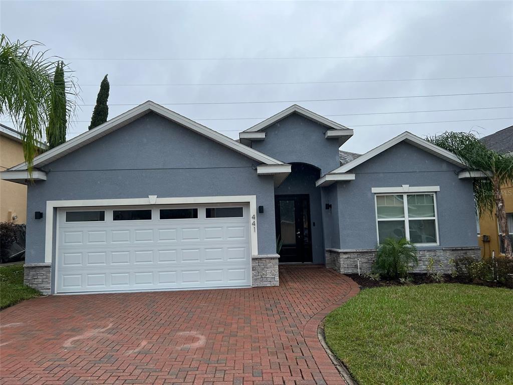 a view of house with garage