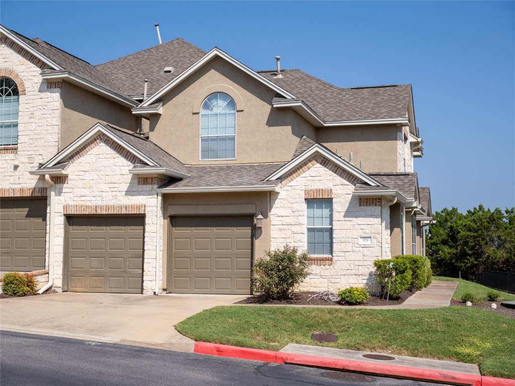 a front view of a house with a yard