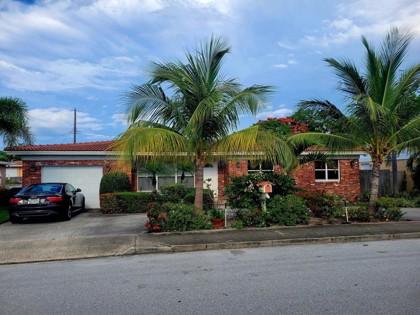 a car parked in front of a house