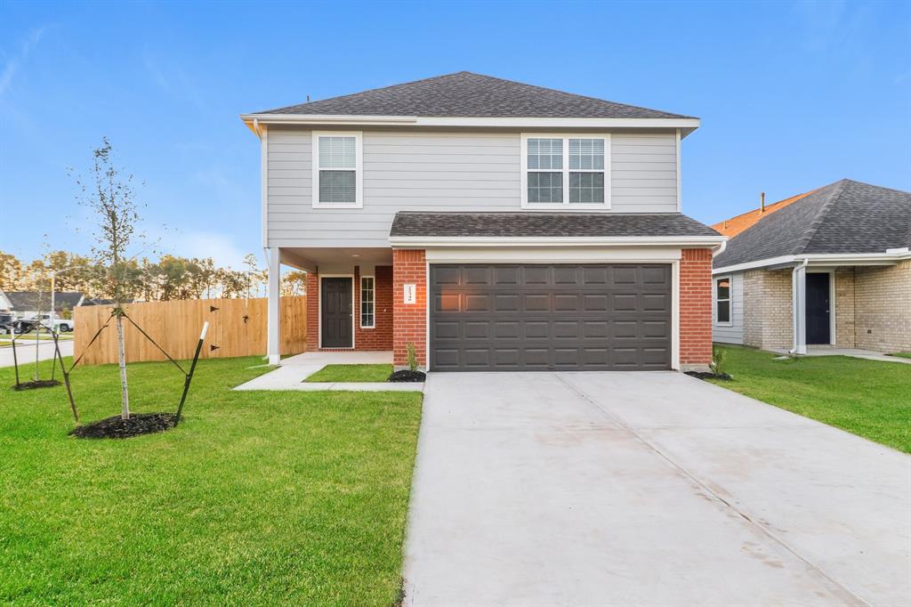 front view of a house with a yard