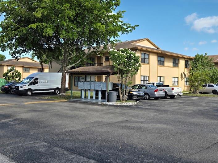 a view of a street with cars