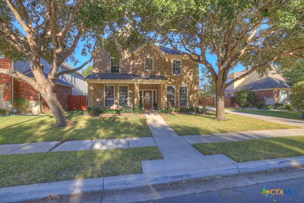 a view of house with yard