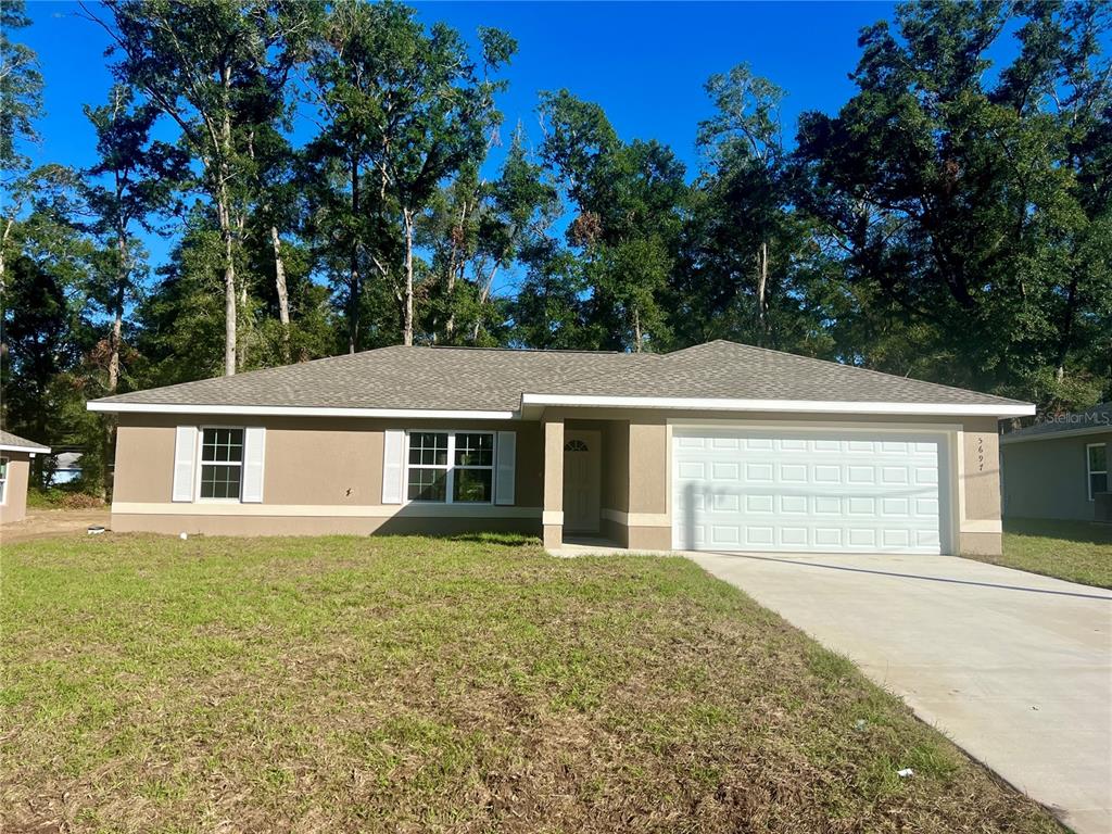 front view of a house with a yard