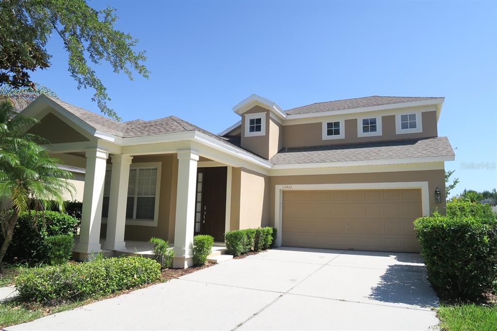 a front view of a house with yard