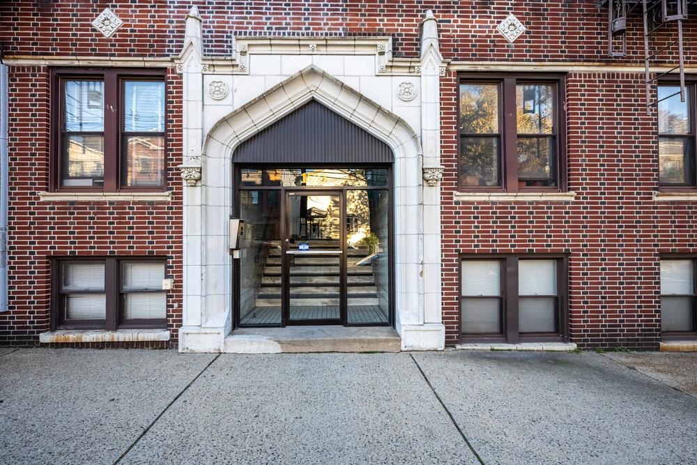 front view of a brick house with a door