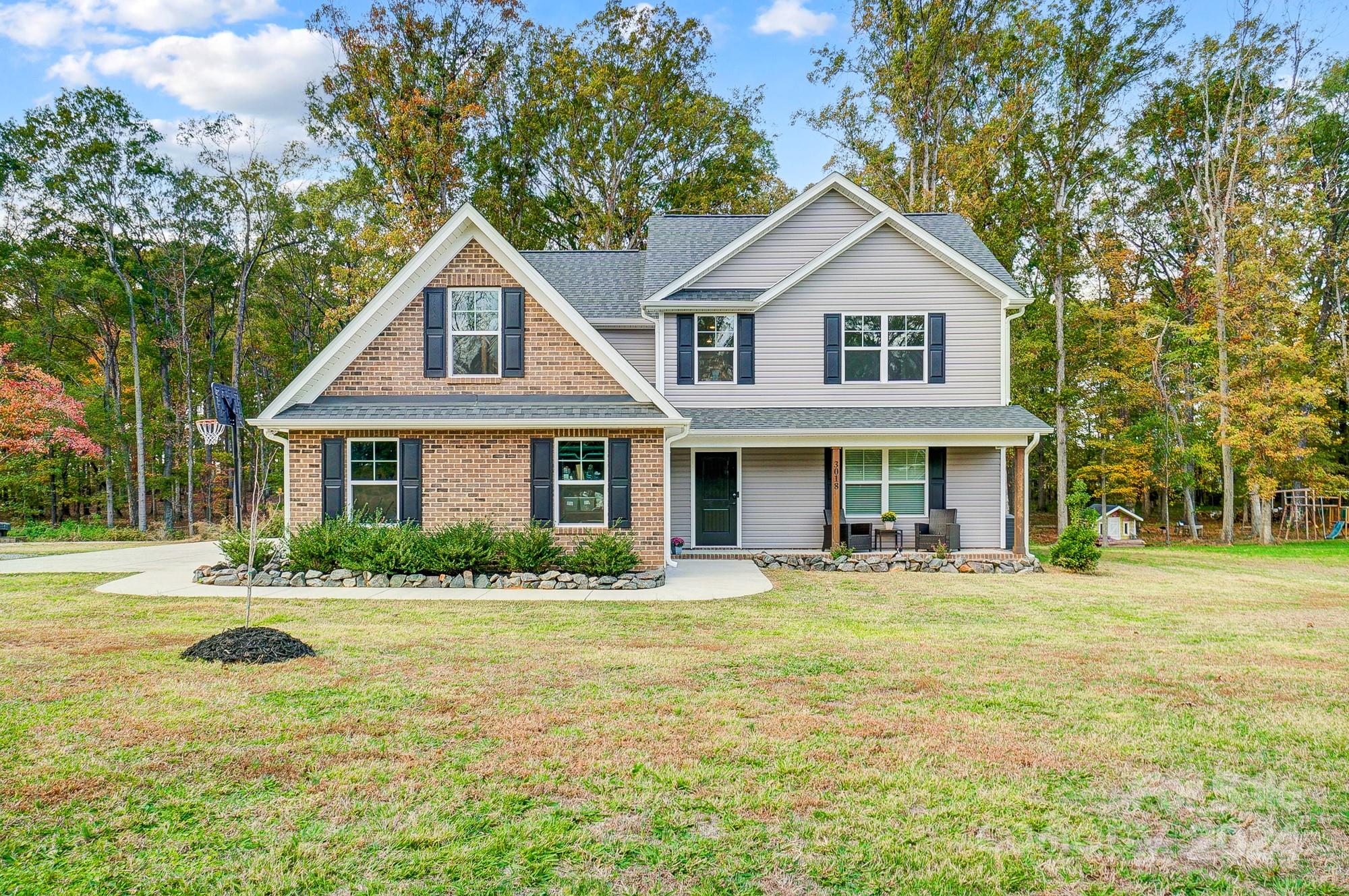 a front view of a house with a yard