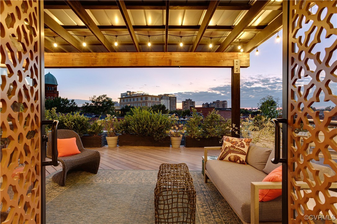 a outdoor living space with patio furniture and a potted plant