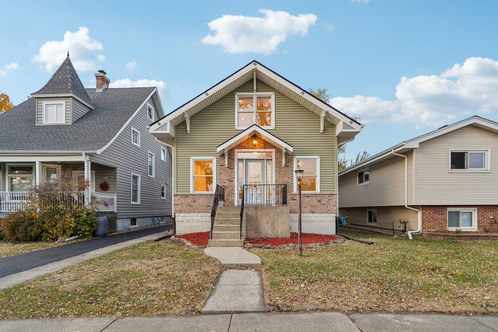 a front view of a house with garden