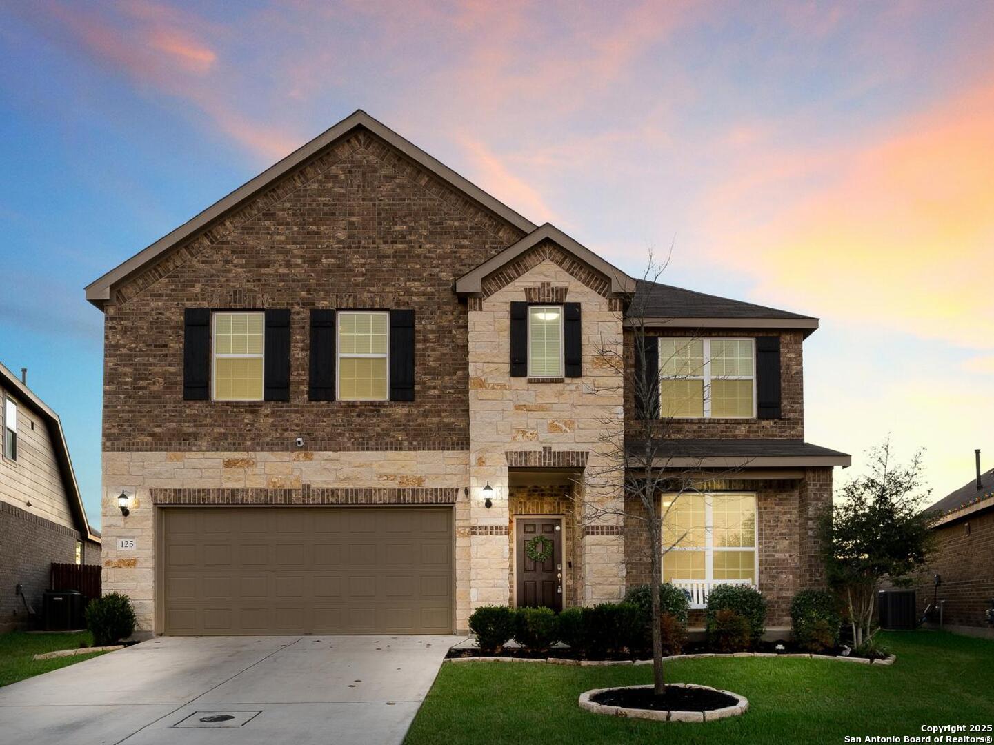 a front view of a house with a yard