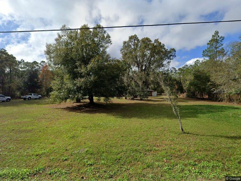 a view of a lake and a yard