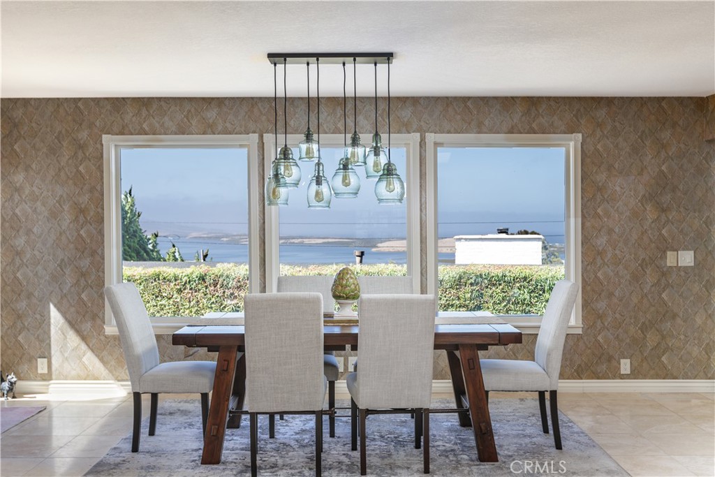 a view of a dining room with furniture window and outside view