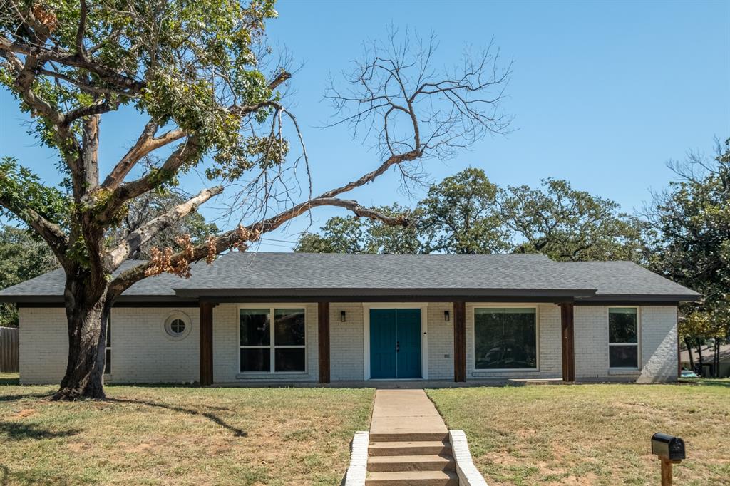 front view of a house with a yard