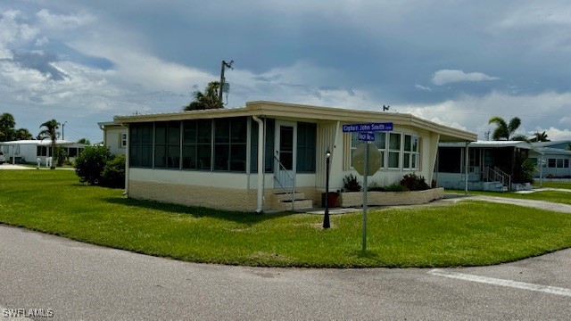 a view of a house with a backyard