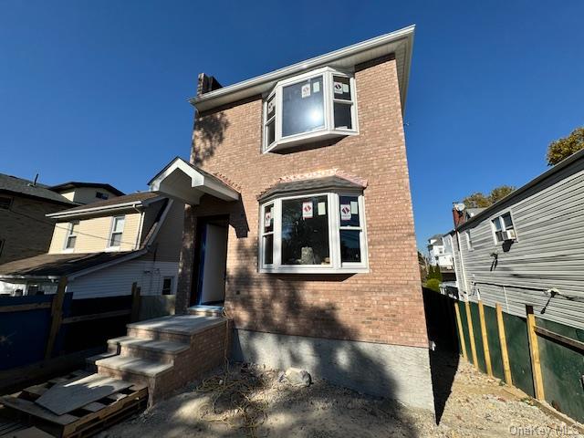 a front view of a house with stairs