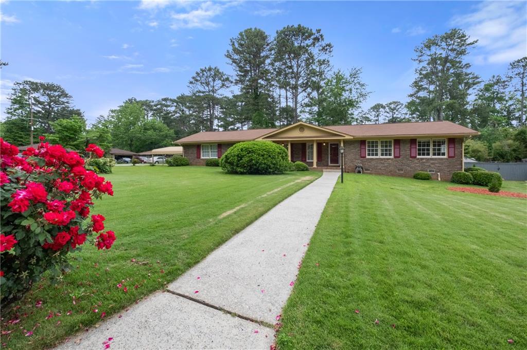 a front view of a house with garden