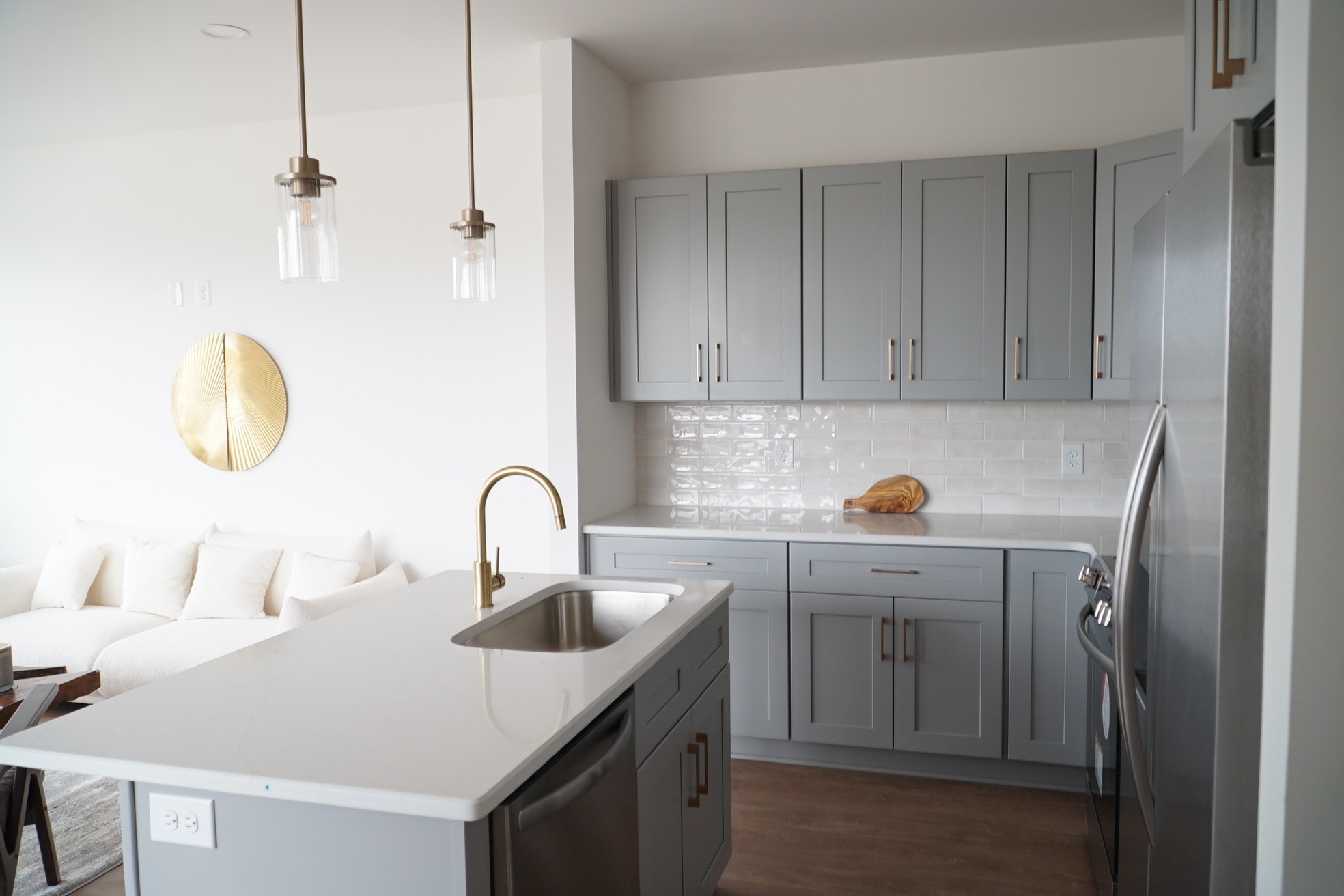 a kitchen with a sink cabinets and appliances