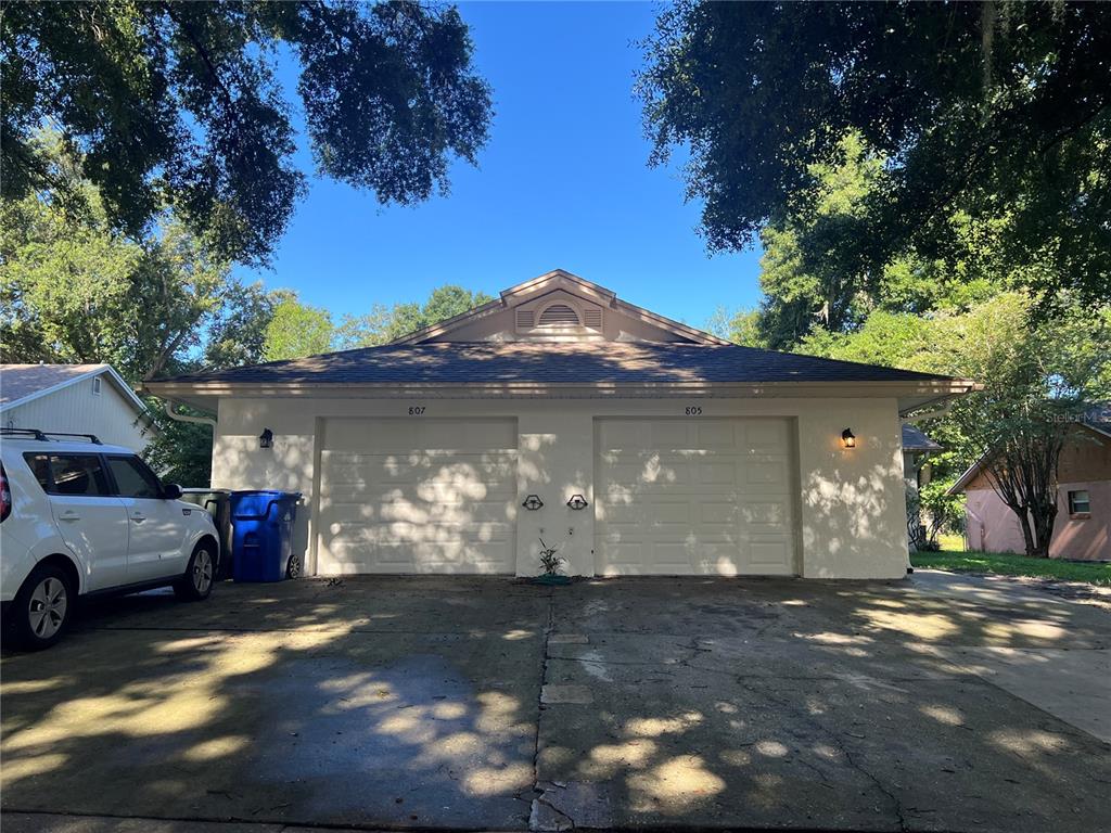 a view of a car park in front of a house