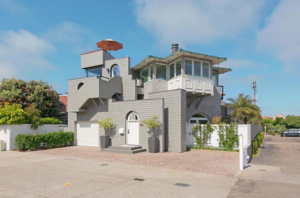 a front view of a house with a yard and a garage