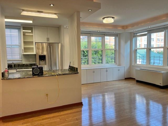 a view of a kitchen with a sink and a large window