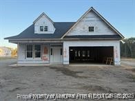 a front view of a house with a garage