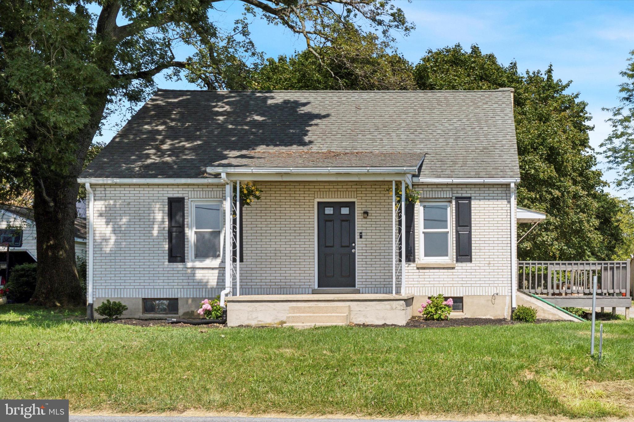 front view of a house with a yard