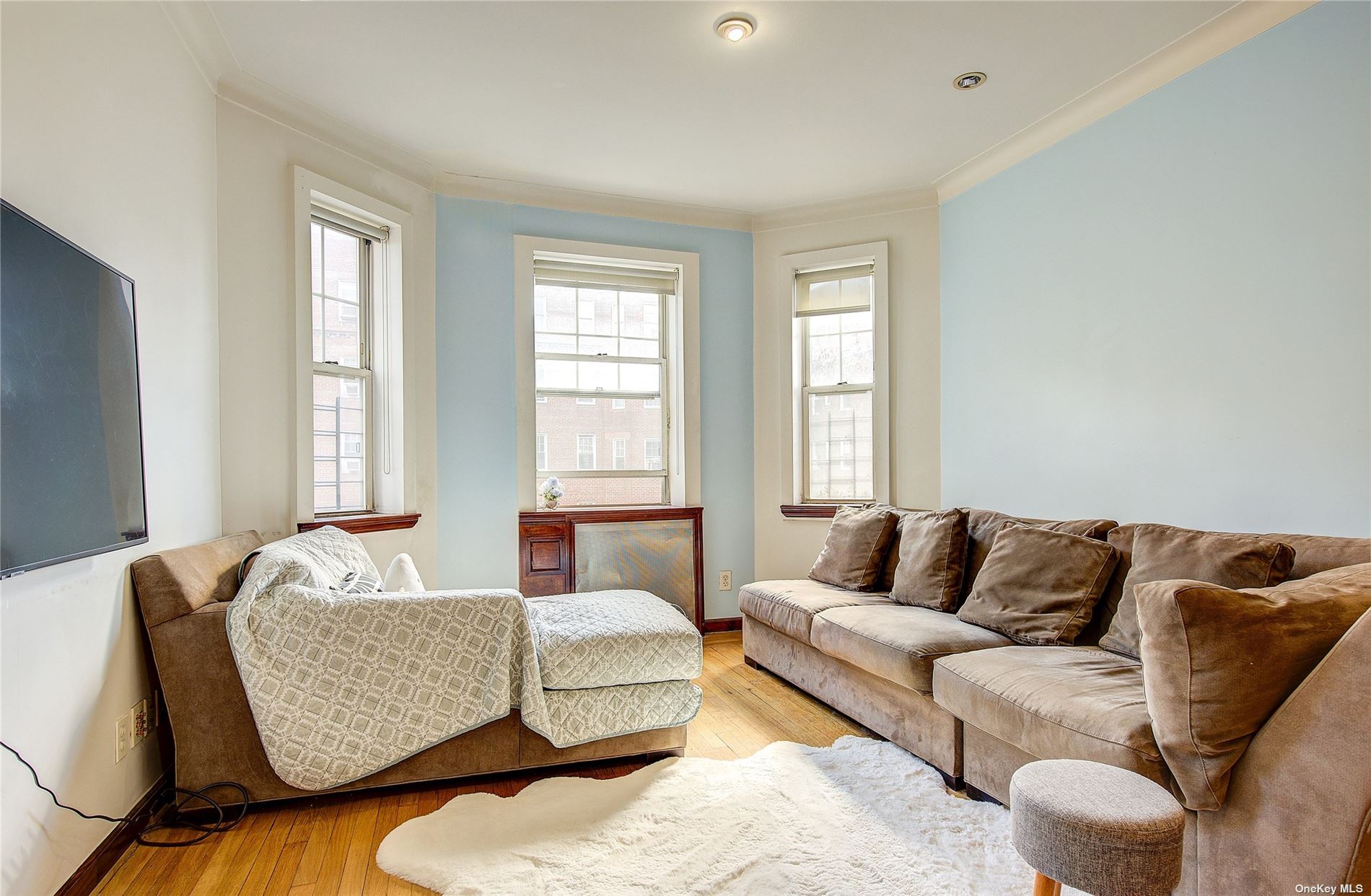 a living room with furniture and windows