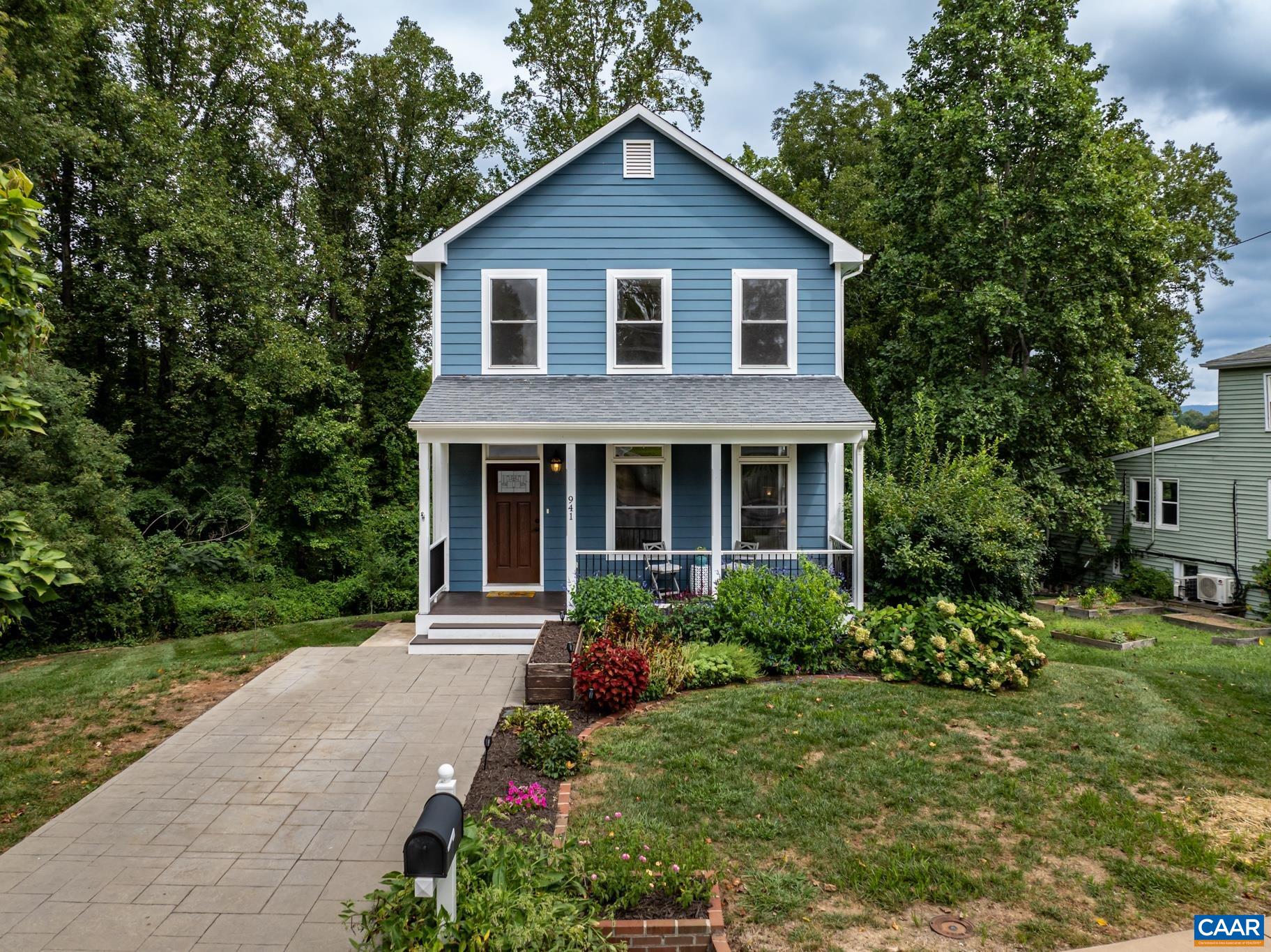 a front view of a house with a yard and porch