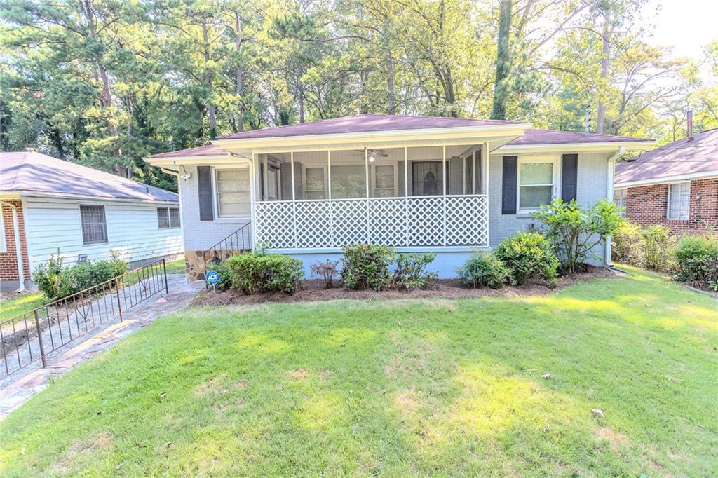 front view of a house with a yard