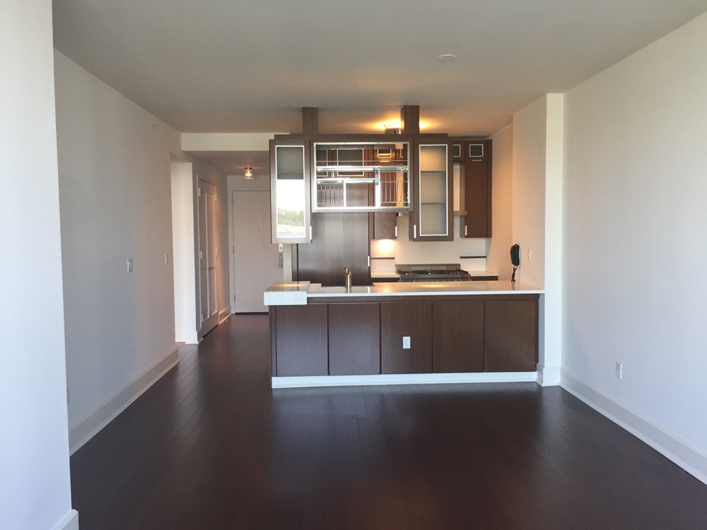 a view of kitchen with window and wooden floor