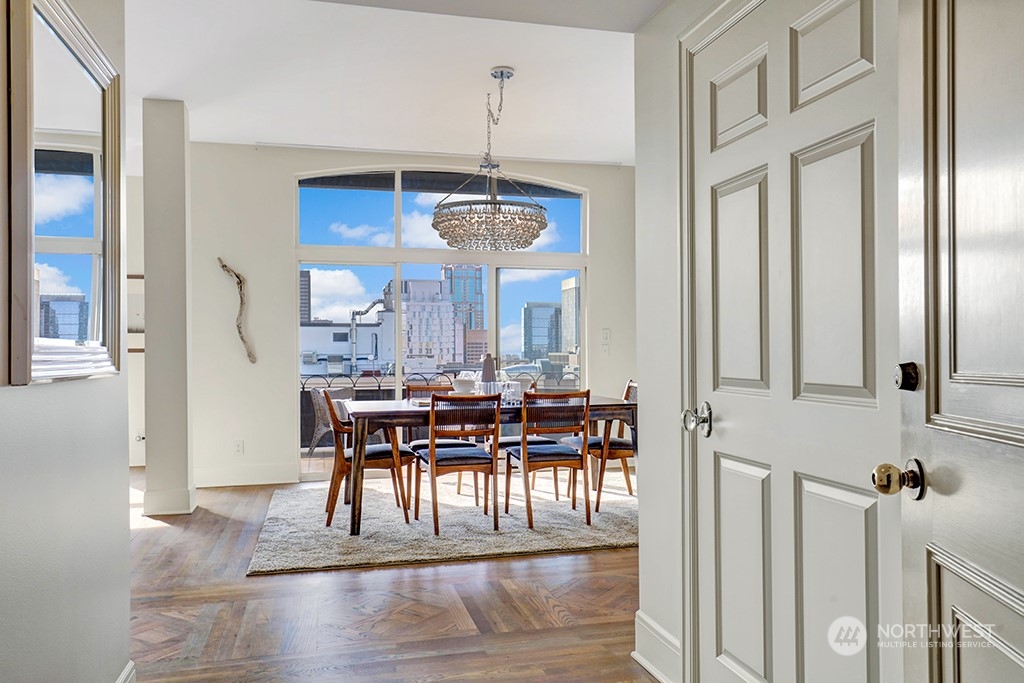 a view of a dining room with furniture window and wooden floor