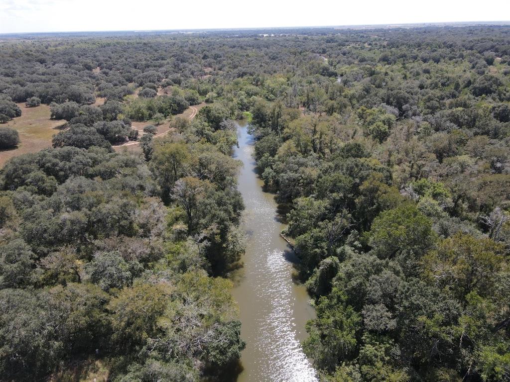 Skull Creek bisects the middle of this property and provides a lush landscape for outdoors activities!