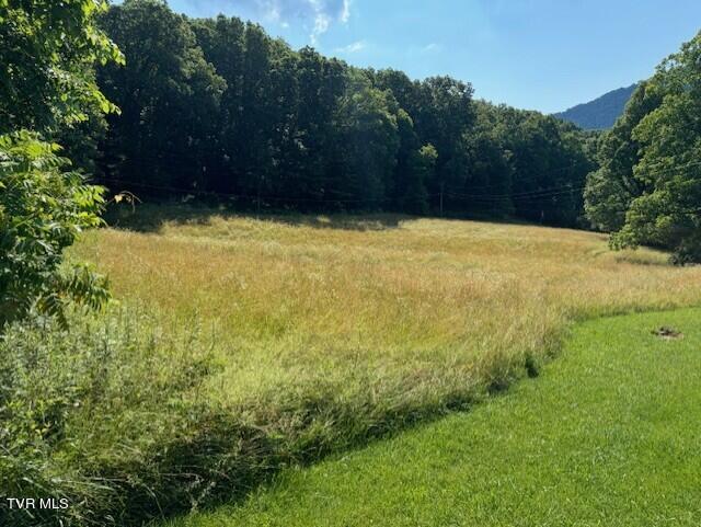 VIEW OF FIELD FROM UPPER PART OF ROAD