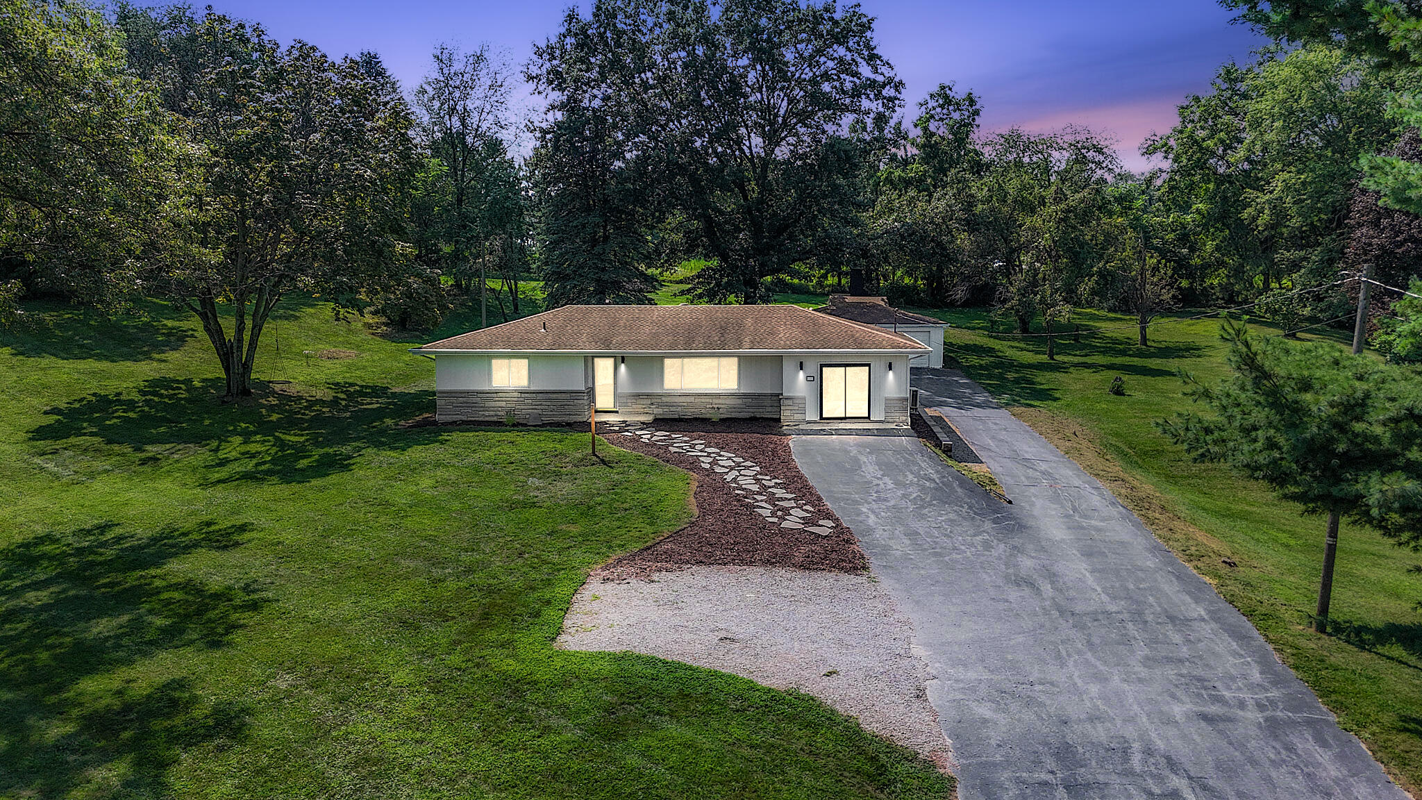 a front view of a house with a yard