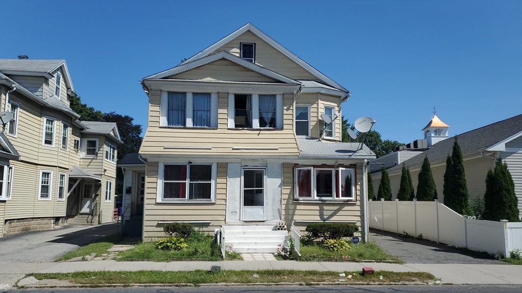 front view of house with a yard