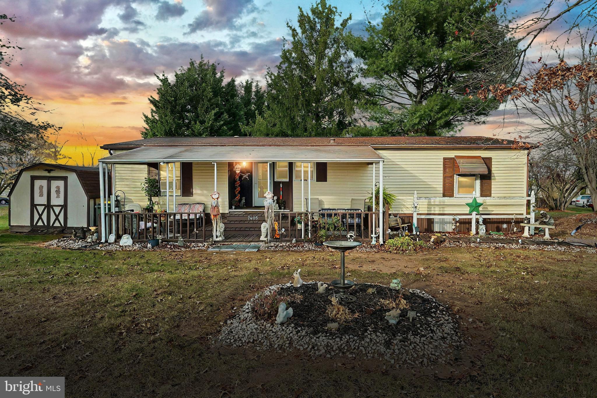 a view of a house with backyard porch and sitting area