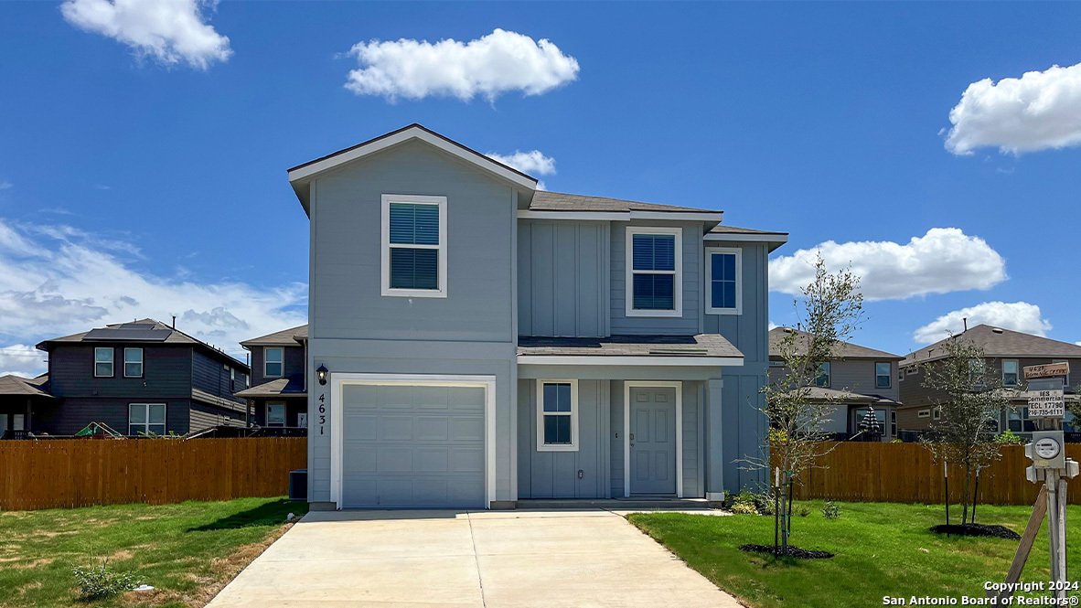 a front view of house with yard and entertaining space