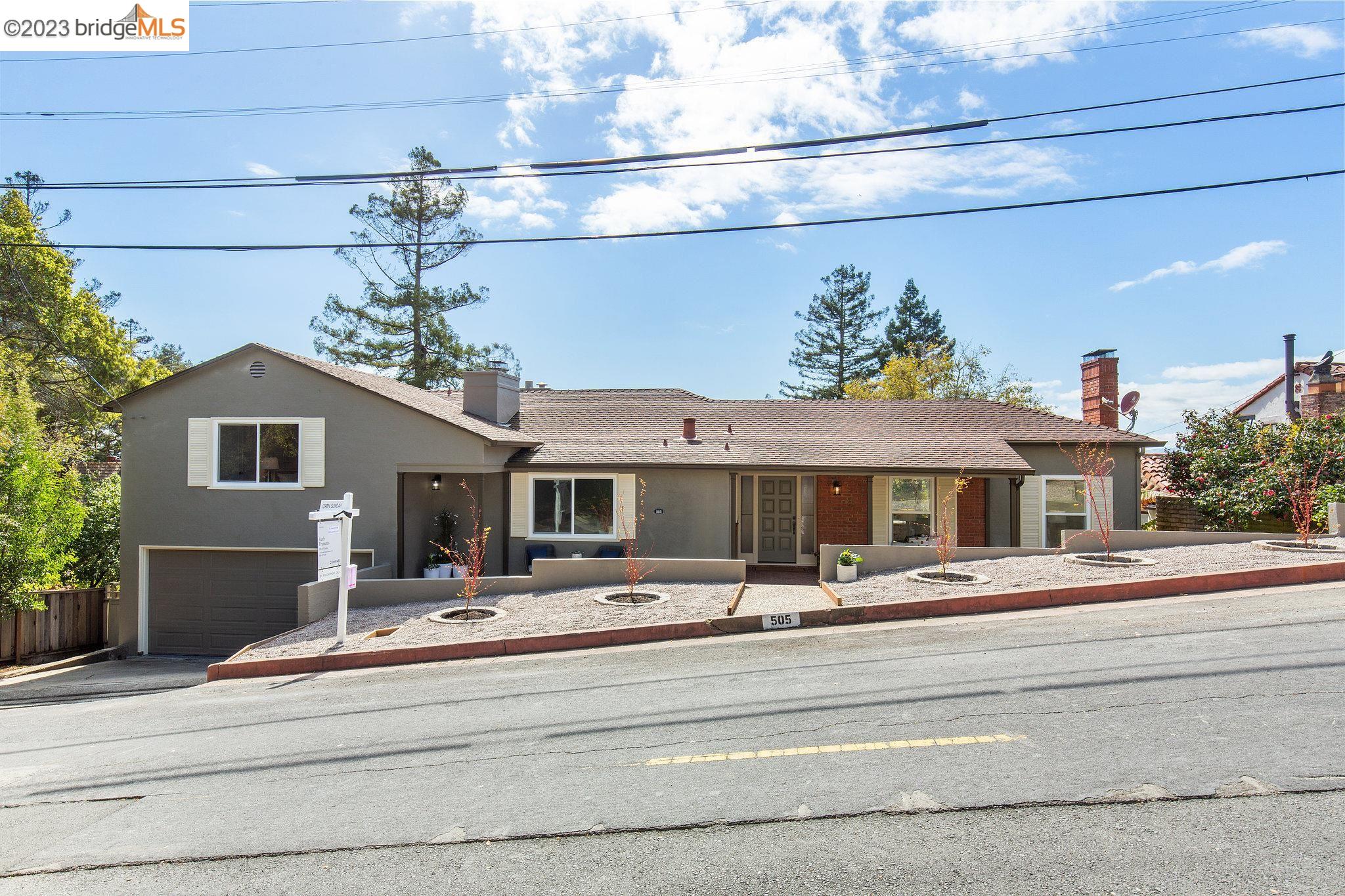 a front view of multiple houses with yard